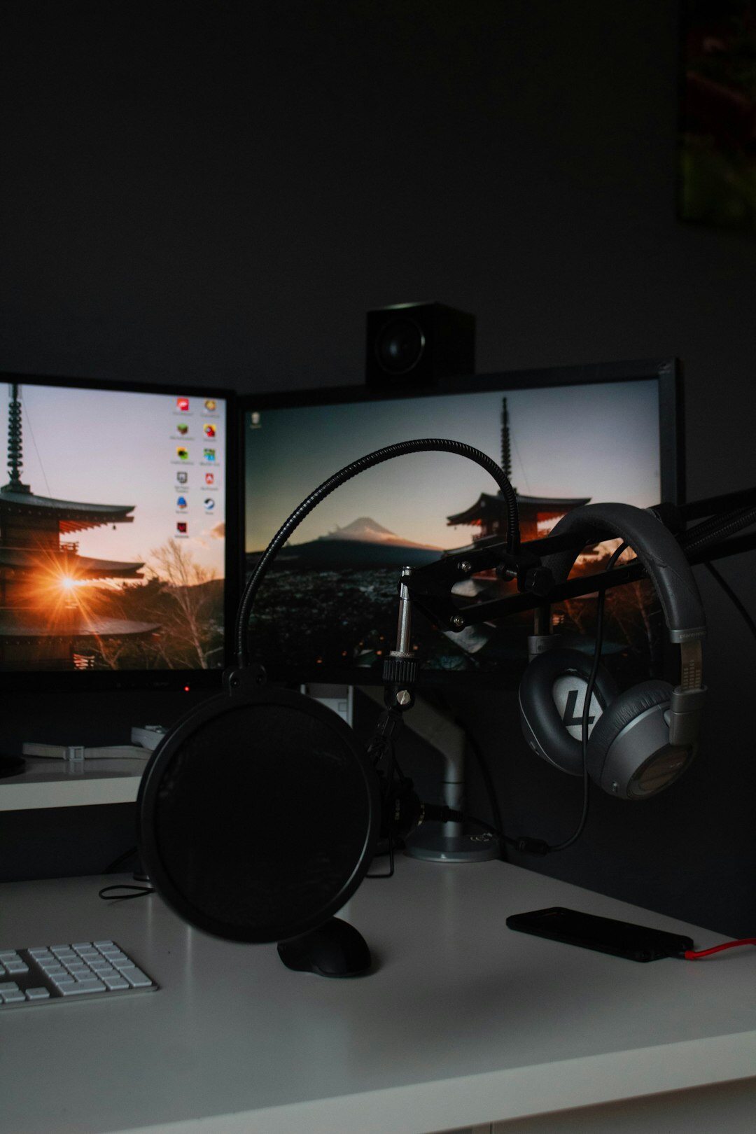 Video editing suite with multiple monitors showing footage